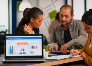 business woman talking about financial project taking notes discussing start up ideas using laptop diverse employees gathered co working working process busy company teamwork help concept 1
