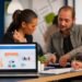 business woman talking about financial project taking notes discussing start up ideas using laptop diverse employees gathered co working working process busy company teamwork help concept 1