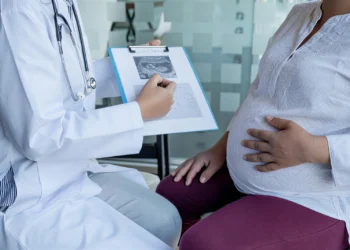 midsection doctor explaining ultrasound pregnant woman hospital 177530 3917 1
