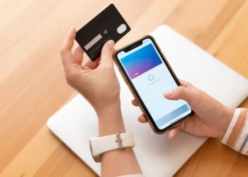 person paying with its smartphone wallet app 23 2149167261.jpg