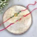 Celebrate Raksha Bandhan with Love Across Miles: Order Rakhi Online To Australia sacred ganesha rakhi duo