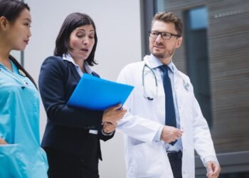 doctors nurse interacting while walking 1