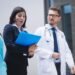 doctors nurse interacting while walking 1