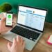 wire transfer young man using his smartphone laptop banking transaction some payments 1