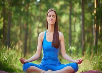 woman lotus pose park 1 1