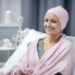 woman with pink towel wrapped around her head simple beauty routine home happy cancer patient smiling woman after chemotherapy treatment hospital oncology department ai generated 2