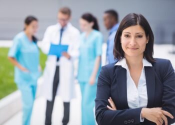 female doctor standing with arms crossed 1